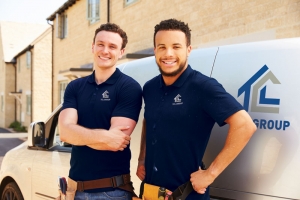 Portrait Of Two Young Tradesmen By Their Van